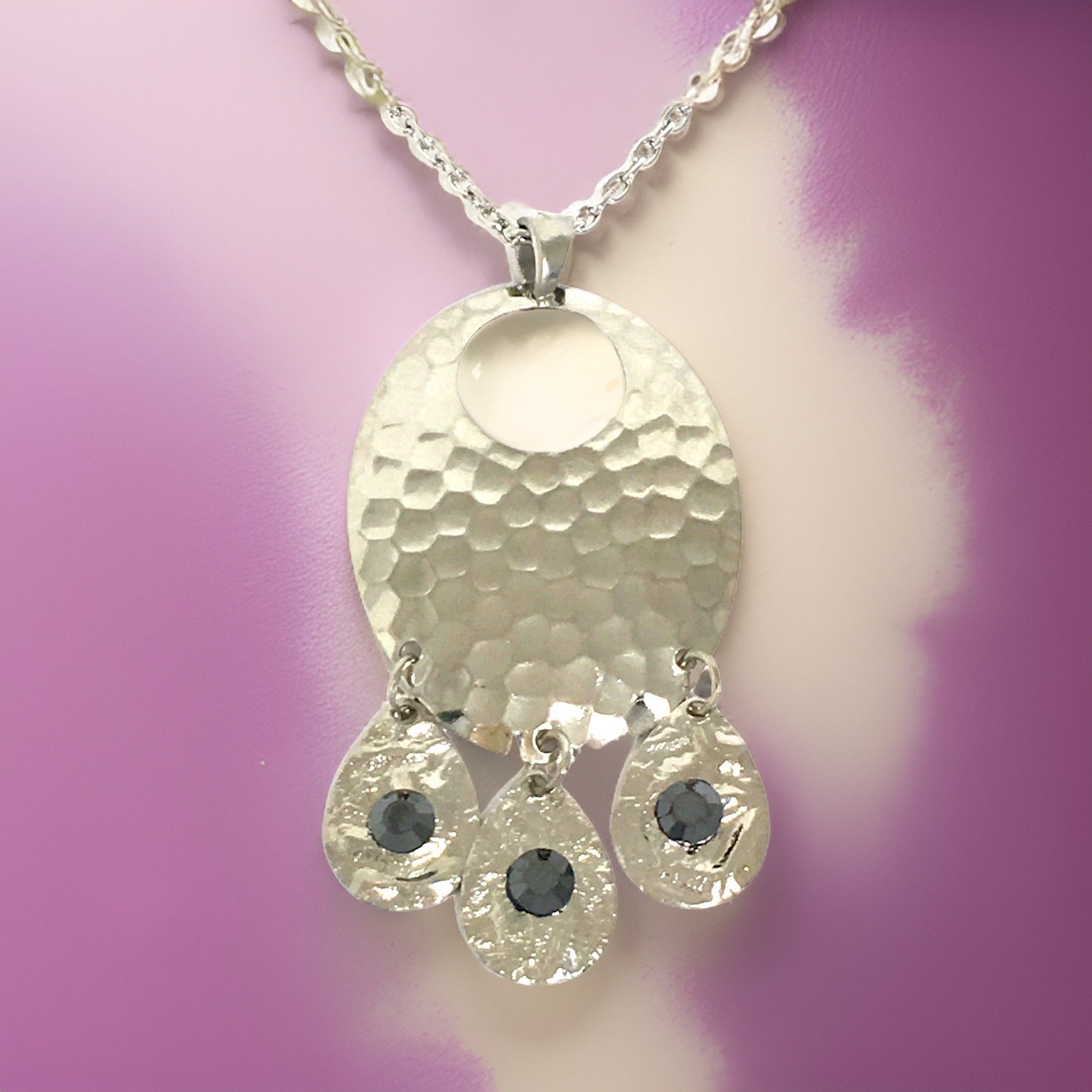 Silver hammered oval shaped necklace with black tourmaline cubic zirconia crystals in a chandelier style necklace with 18” chain 